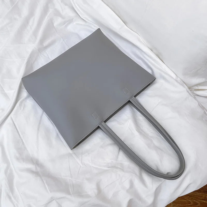 Bolso de mano femenino de estilo moderno Este bolso de hombro para mujer combina diseño elegante con funcionalidad, ideal para uso diario o eventos especiales. Su estilo fashion y forma casual tote lo hacen versátil para múltiples ocasiones.